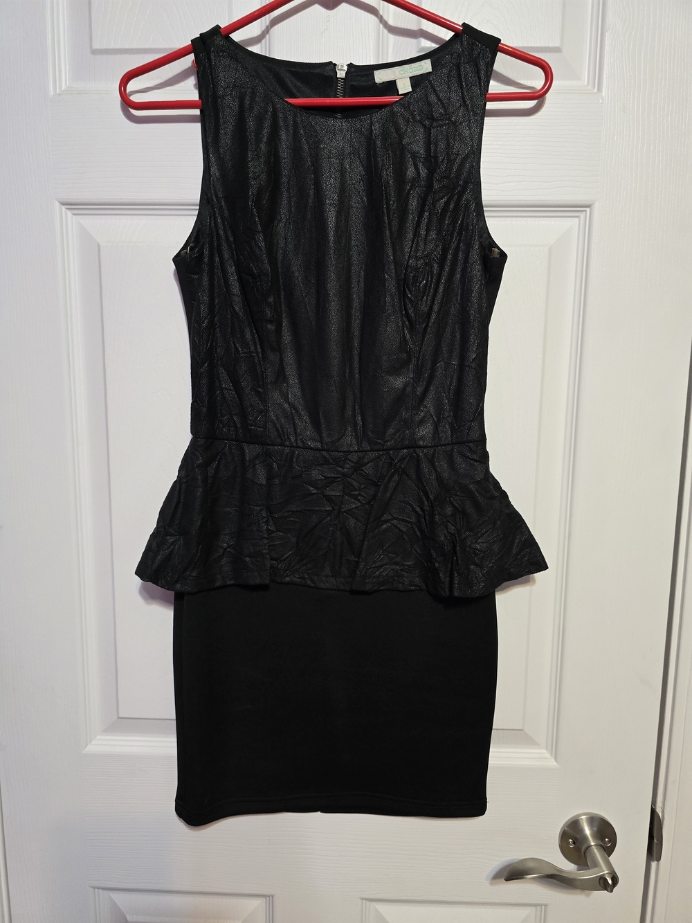 Sleek Black Sleeveless Peplum Mini Dress